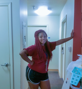 Transfer student Chris Johnson preparing to move into her digs (Photo by Charles A. Smith)