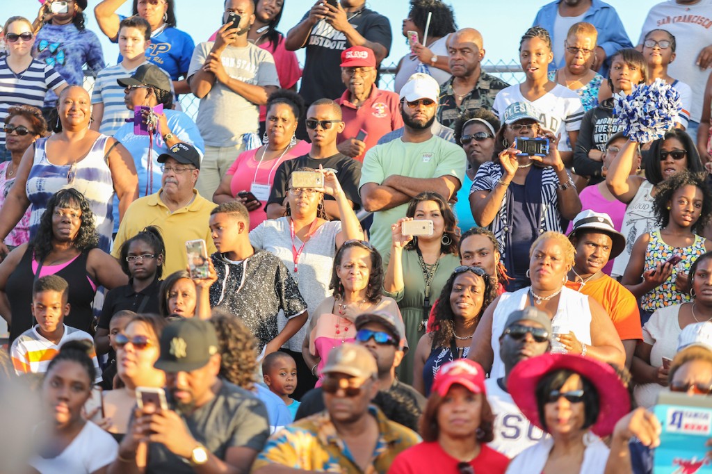 A crowd of spectators stands to their feet as JSU struts onto the field of Pearson Community Center. (Photo by Charles A. Smith/JSU)