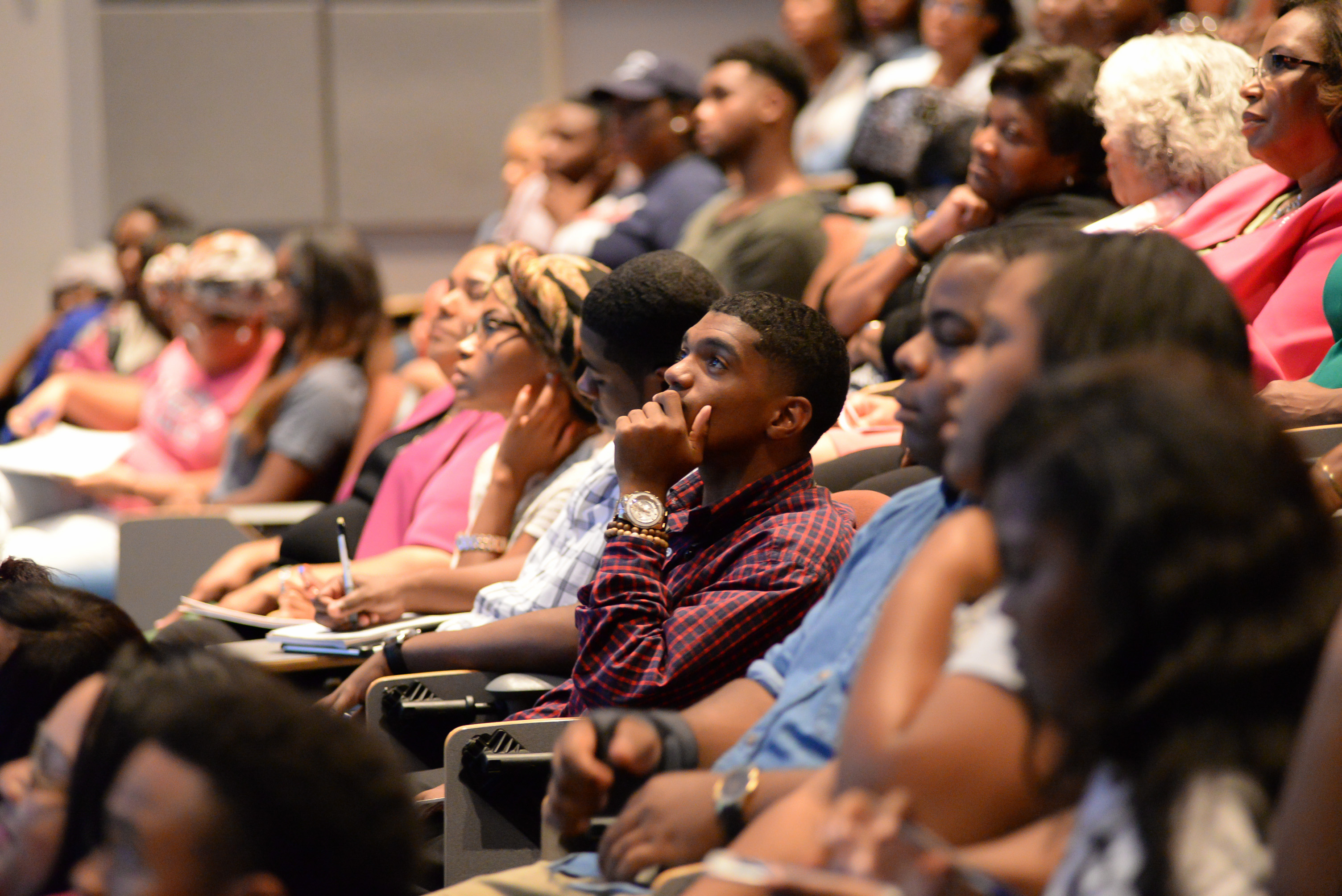 Glued to their seats with rapt attention, a captive audience views a big-screen monitor broadcasting the first presidential debate between Donald Trump and Hillary Clinton. The two candidates sparred on a number of hot-button issues, including recent controversial police shootings, taxes, economy and jobs. (Photo by Darek Ashley/JSU)