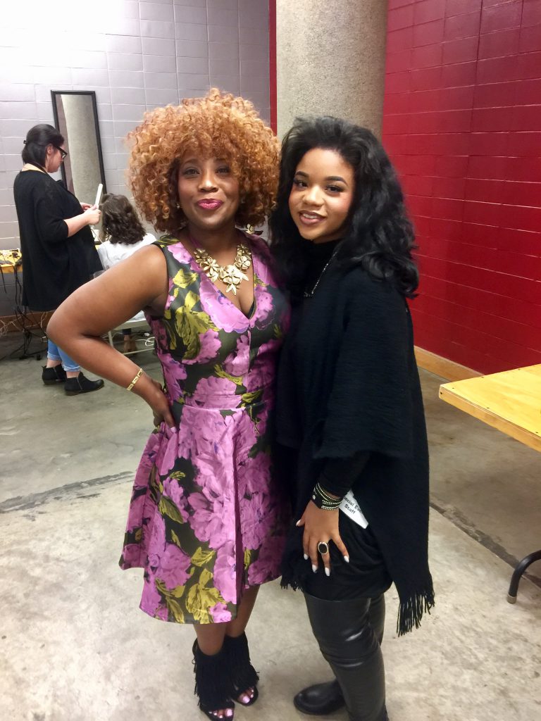 Carter-Simmers, left, joins India Jones, a makeup artist representing Belk department store. Carter-Simmers participated in the 2016 Mistletoe Marketplace fashion show on Nov. 4 inside the Mississippi Trademark, which was presented by the Junior League of Jackson. (Photo By Dwain Doty/WJSU)