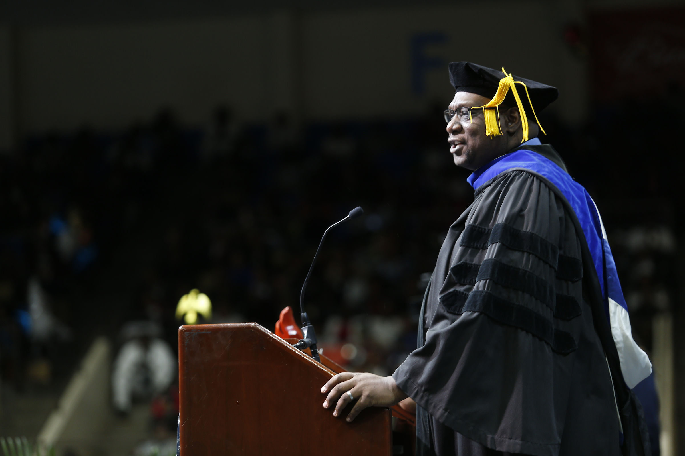 Keynote speaker Dr. Mark Henderson, dean of the JSU speech and theater department, gave a moving and melodramatic speech that ended with the graduates on their feet. (Photo by Charles A. Smith/JSU)