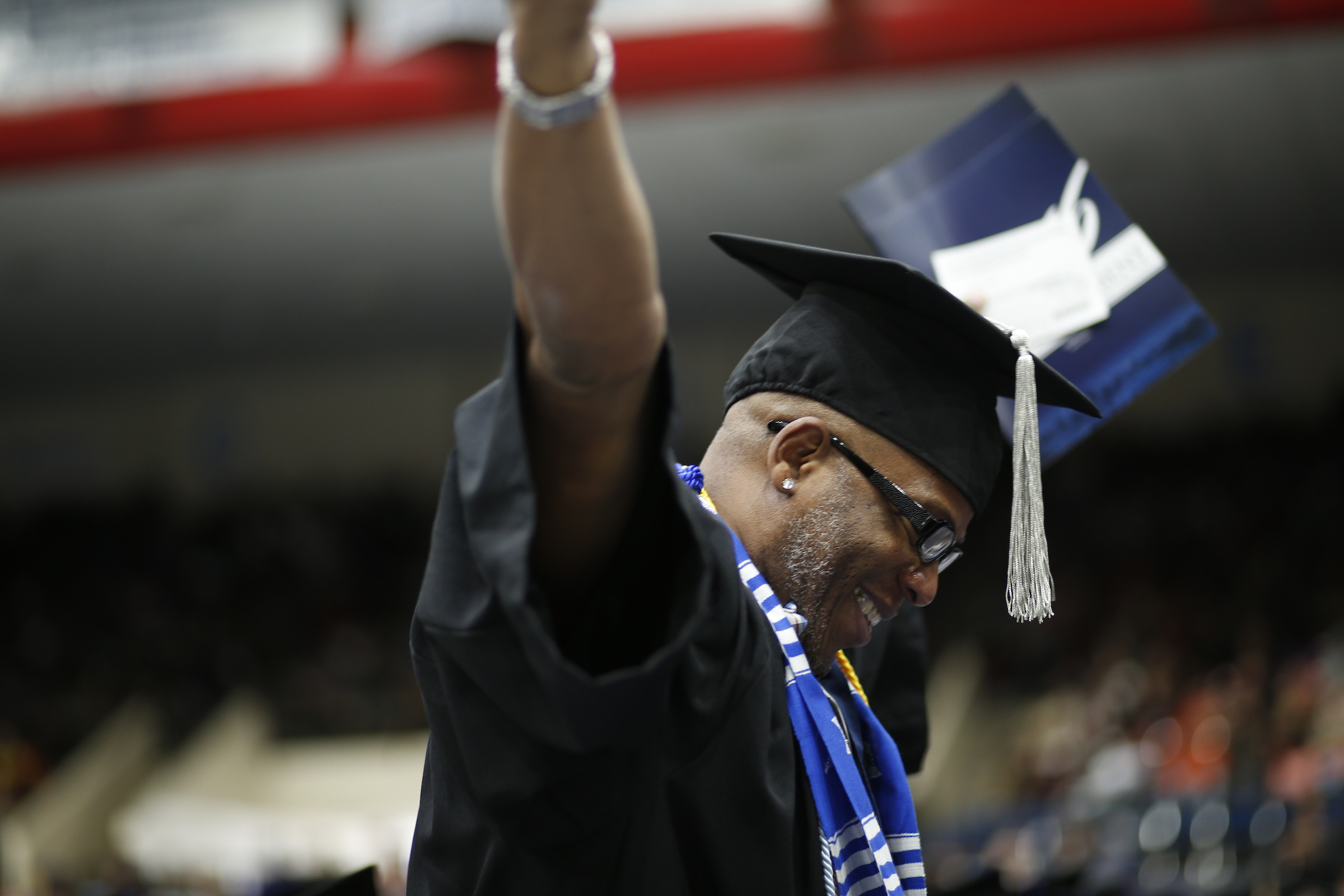 Keith Kennard cannot contain his elation over receiving his degree putting an end to a 6 hour commute from Atlanta to Jackson over a 2-year time frame. (Photo by Charles A. Smith/JSU)