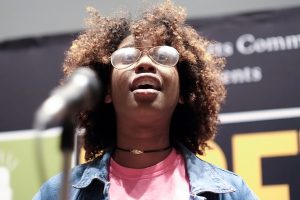 Tyler Hardin, a junior marketing major at JSU, performed her original work "Black Hair Matters" at Poetry Out Loud on Wednesday. (Charles A. Smith/JSU)