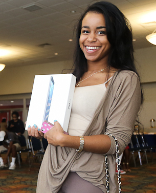 One happy "customer" proudly displays her coveted prize. (Photo by Charles A. Smith/JSU)