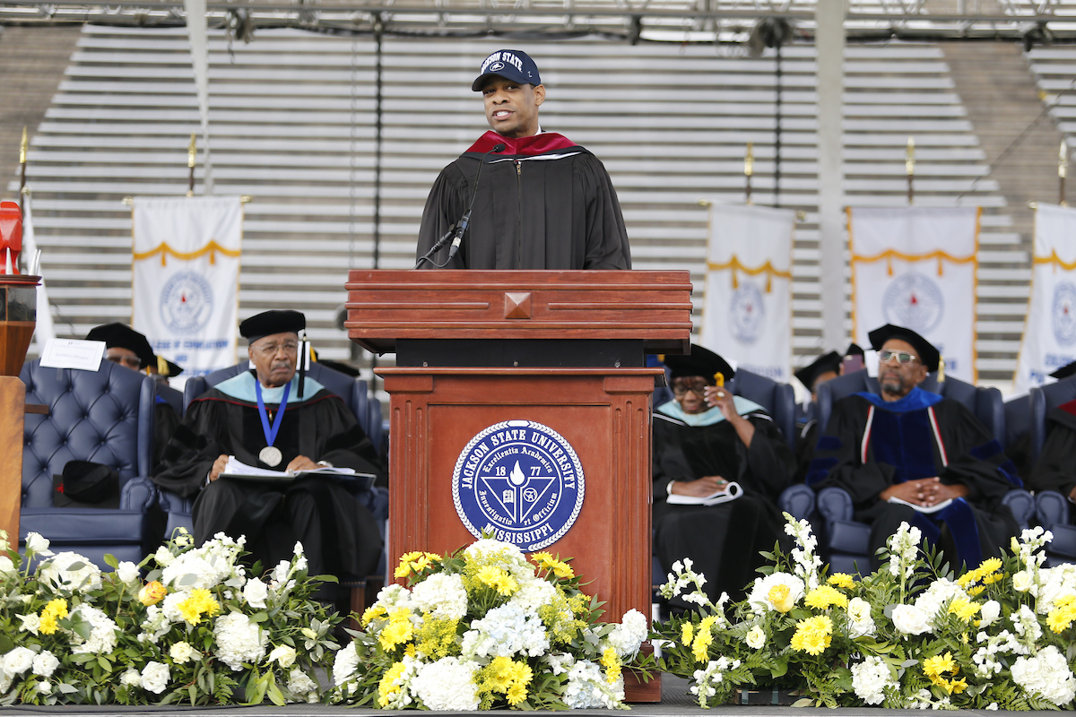 Undergraduate commencement speaker DeMarco Morgan, a national CBS News correspondent, tells his compelling story about how he rose to one of the top broadcasting networks from humble beginnings. He credits Jackson State for taking a chance on him when other institutions of higher learning denied him. He spoke Saturday to an audience of thousands in the Mississippi Veterans Memorial Stadium (Photo by Charles A. Smith/JSU)