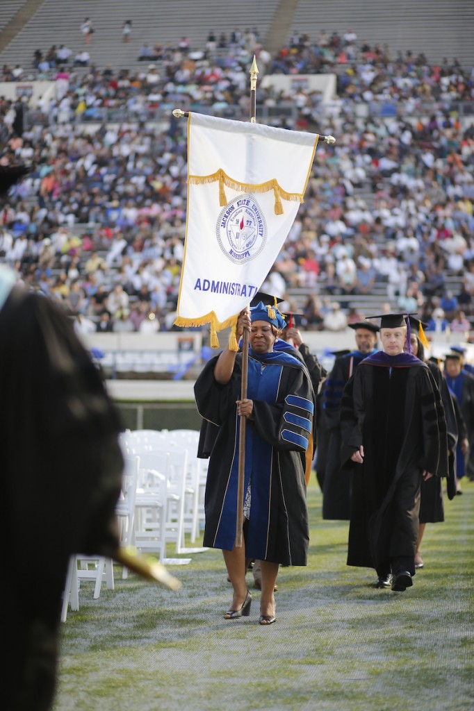 Dr. Nicole Evans, vice president for Enrollment Management and Institutional Research, leads JSU administrators to the stage. (Photo by Charles A. Smith/JSU)