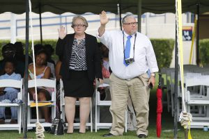 Rogelio V. Solis, a JSU alum and longtime photographer with the Associated Press, acknowledges the crowd after his mother is posthumously bestowed emeritus status. Maria Luisa Alvarez Harvey was a 50-plus year professor at JSU. Also, Solis is proud about the renaming of the Honors College to the W.E.B. Du Bois and Maria Luisa Alvarez Harvey Honors College. Solis is accompanied by wife Debbie Skipper. (Photo by Charles A. Smith/JSU)