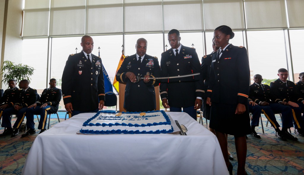 Brookins and Twitty join newly commissioned second lieutenants for the congratulatory cake-cutting ceremony. (Photo by Kentrice S. Rush/JSU)