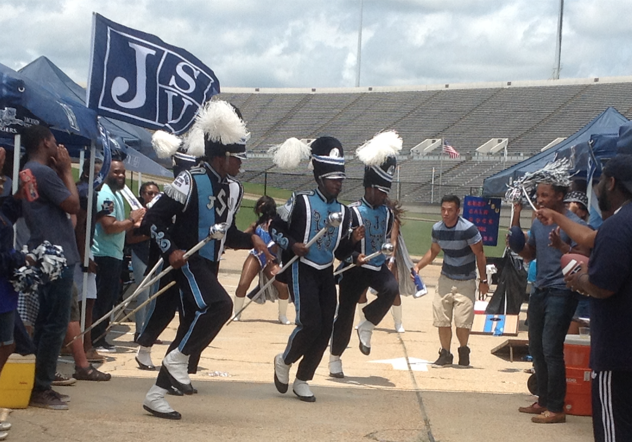 J-5 drum majors strut during a simulated tailgating scene for a C Spire commercial that will begin airing in August ahead of football season. (Photo by L.A. Warren/JSU)