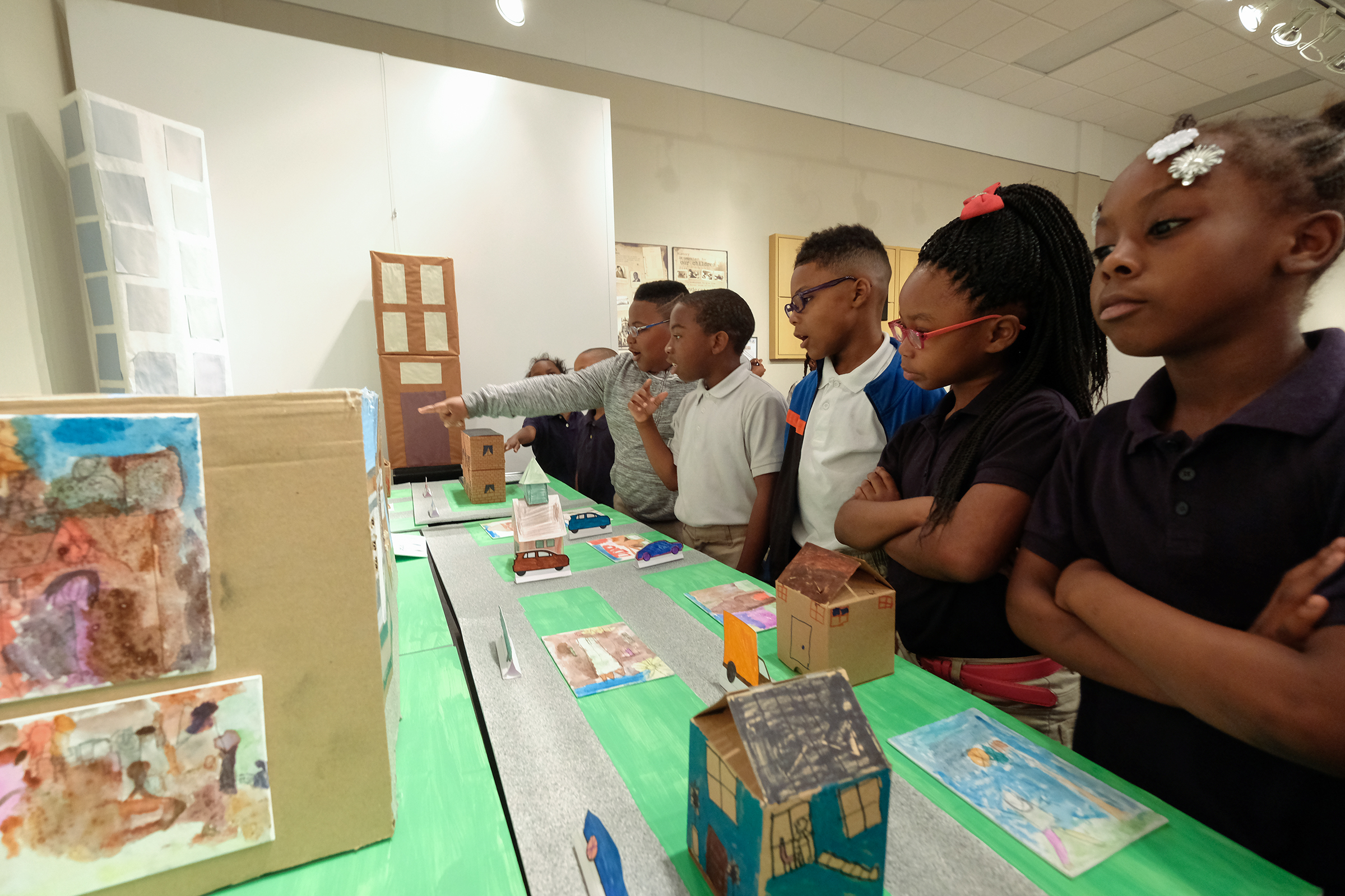 Elementary students from Jackson Public Schools admire the artwork of their peers during a visit inside the art gallery of Johnson Hall on the main campus of Jackson State University. The 3D piece produced by Brown Elementary is called “One Community.” It’s designed to enhance students’ understanding of their surroundings. Students used cardboard, pipe cleaners, modeling clay and paint to design and build structures. (Photo by Charles A. Smith/JSU.)