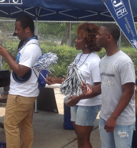 JSU extras Nicholas Armstrong, left, Brittany Edwards and Jamarion Wright participate in the tailgate production. (Photo by L.A. Warren/JSU)