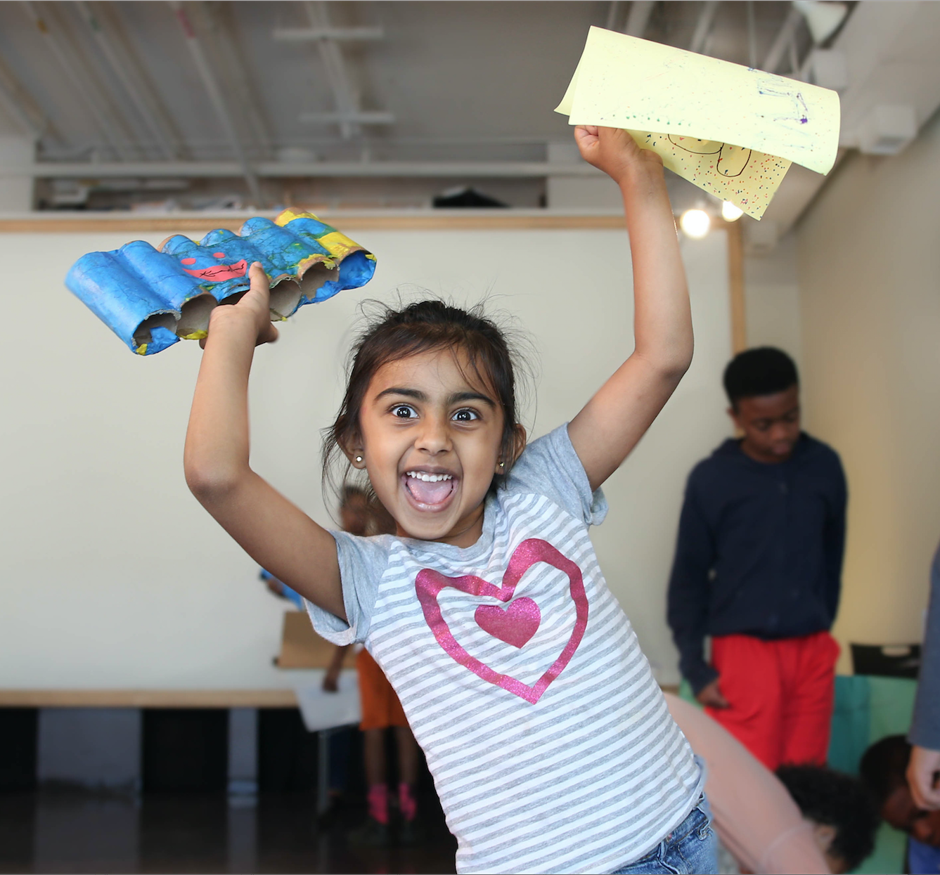 One adorable student shows her enthusiam after Mason's pop-art class. (Photo by Kentrice S. Rush/JSU)