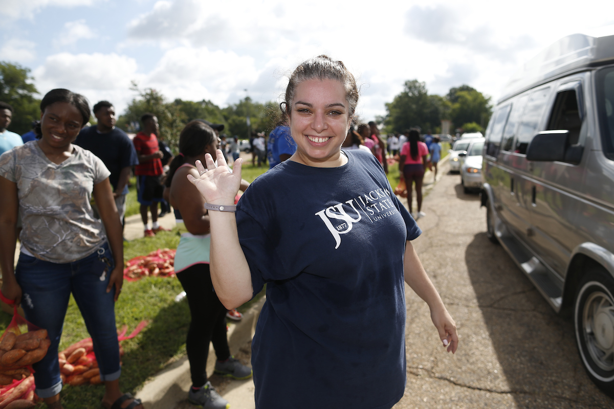 Heather Wilcox, neighborhood development assistant for the Center for University-Based Development at Jackson State University, spearheaded Crop Drop III with a number of community partners. Tuesday’s event was held in the parking lot across from Blackburn Laboratory Middle School, 1311 W. Pearl St. (Photo by Charles A. Smith/JSU)