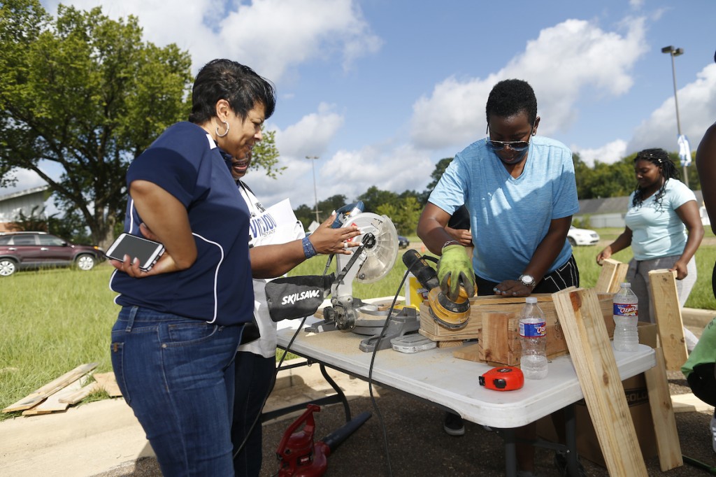 JSU’s first lady Deborah E. Bynum observes the construction of a container garden. (Photo by Charles A. Smith/JSU)