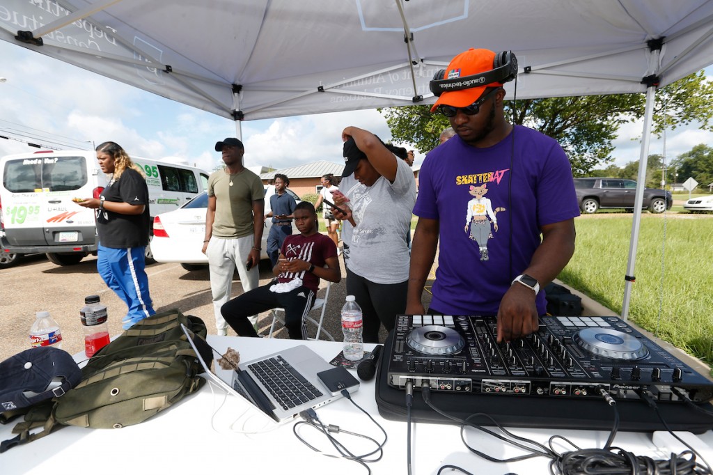 A DJ kept the spirit of the crowd alive and the rhythm moving with fast-popping, upbeat music. (Photo by Charles A. Smith/JSU)