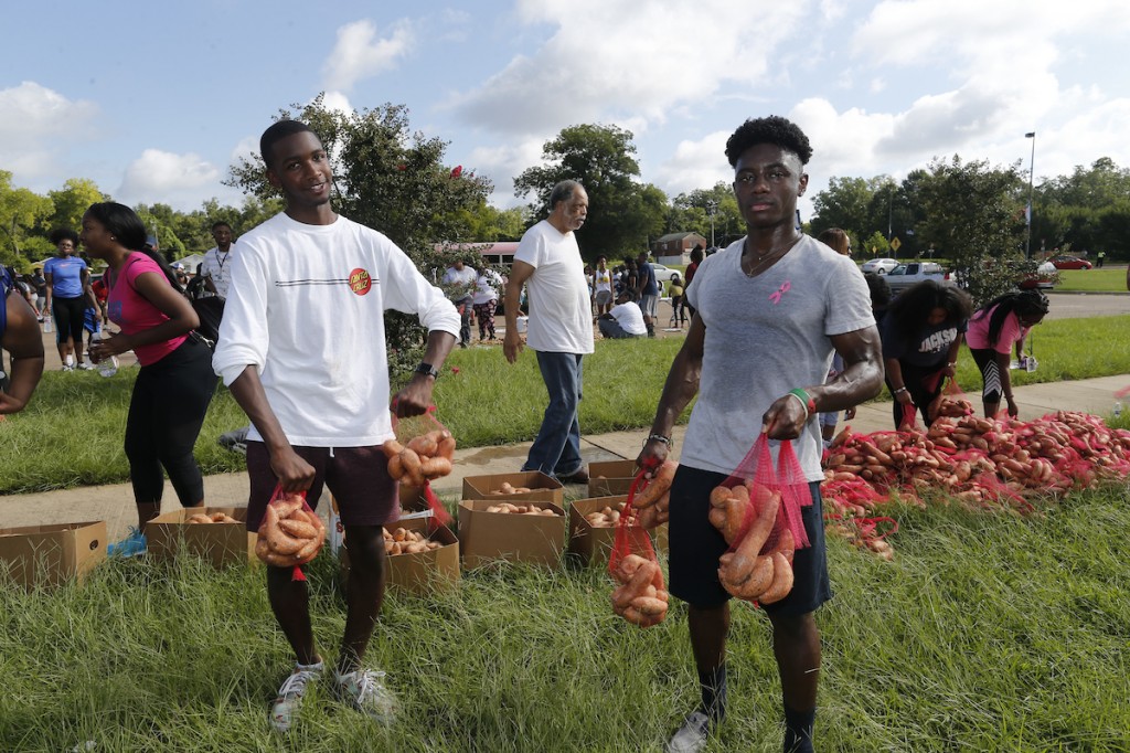 With the sun beaming down, some volunteers were drenched in sweat. Still, the community service was well worth it. (Photo by Charles A. Smith/JSU)
