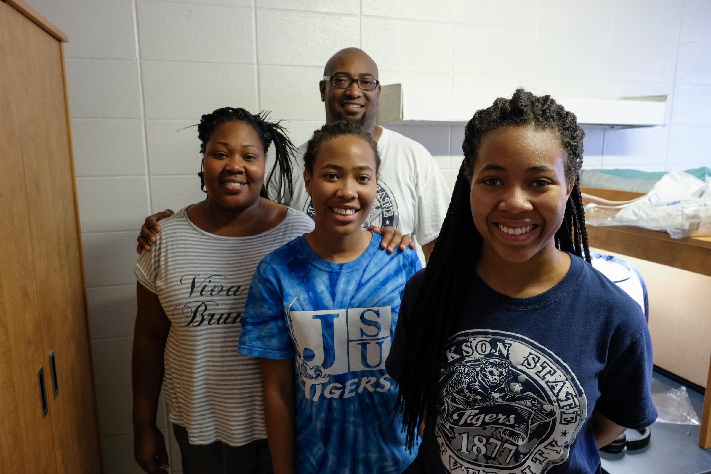 The Crayon Family: Donald, Kolisha, J'lani and Kamryn take a break from unpacking to pose for a picture. Donald Crayton said he hopes college will not be too easy for his daughter Kamryn "because we need her to understand life and that there will be challenges." (Photo by Charles A. Smith/JSU)