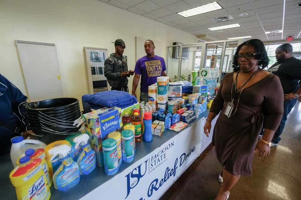 Dr. Kimberly Hilliard, exec director in the Office of Community Engagement at JSU, inspects items that will be shipped to Texas. (Photo by Charles A. Smith/JSU)