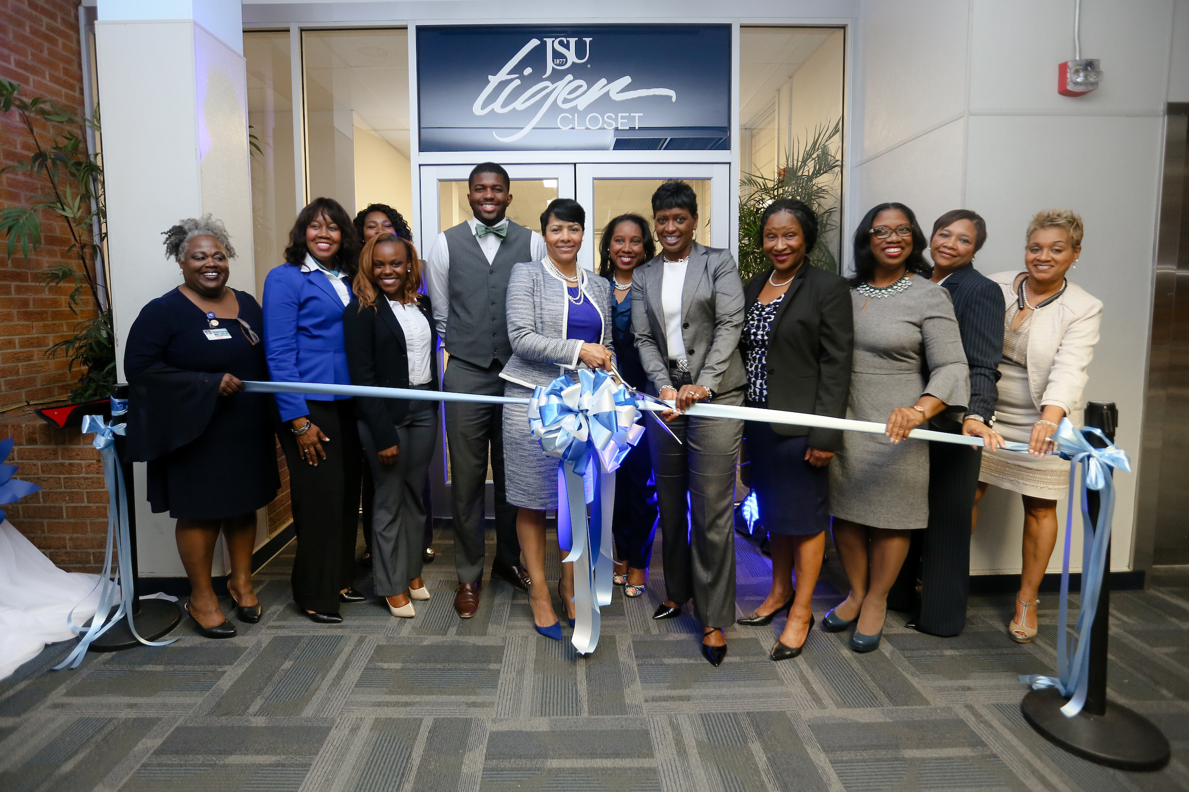 First lady Deborah Elaine Bynum prepares to cut the ribbon signaling the grand opening of the JSU Tiger Career Closet as she is flanked by those who helped bring her University initiative to fruition. (Photo by Anissa Hidouk/JSU)