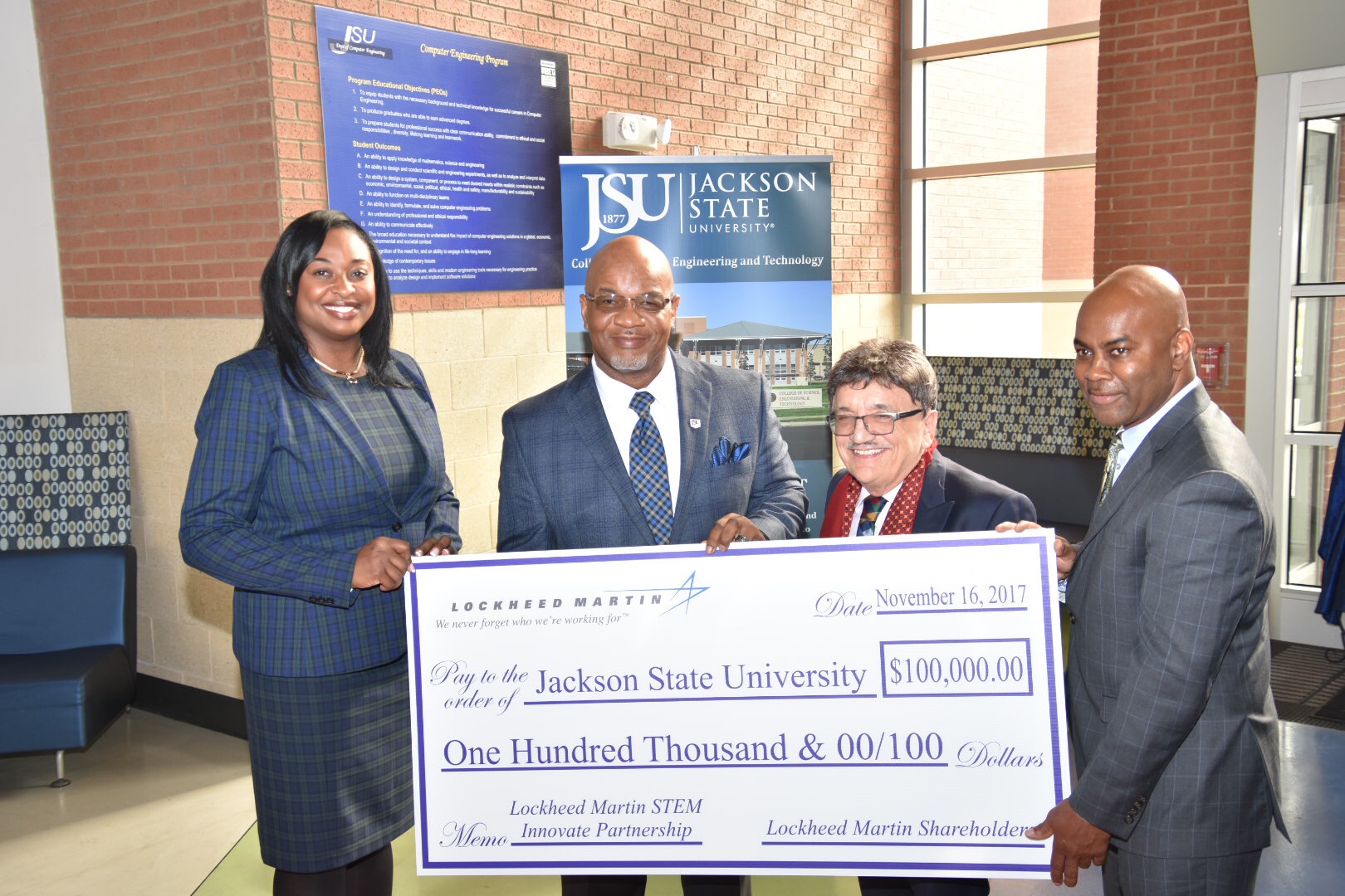 JSU President William B. Bynum Jr. displays his appreciation to Lockheed Martin for its donation to the College of Science, Engineering and Technology (CSET). He’s joined by Lockheed director Karmyn Norwood, a JSU alum; Dr. Richard A. Alo, dean of CSET; and Derrick McGowan, diversity outreach manager for Lockheed. (Photo by Kevin Bradley/Special to JSU)