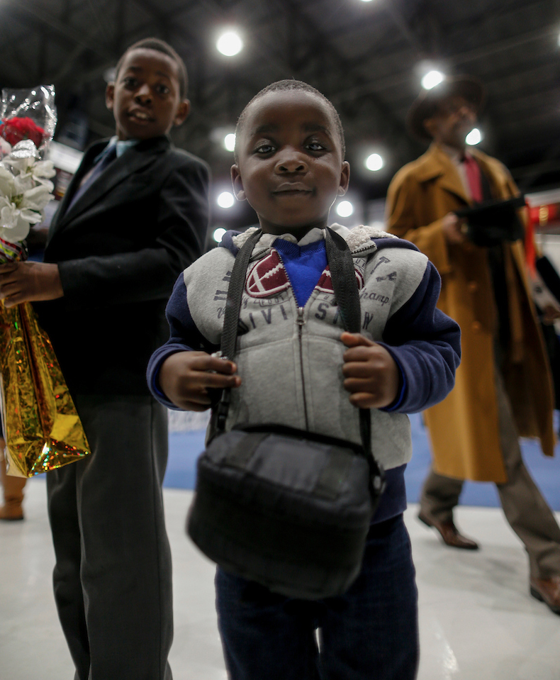 Young attendees proudly show their support at the graduation ceremony. (Photo by Charles A. Smith/JSU)