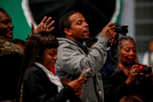 Guests train their lenses onto the stage to capture the significant milestone. (Photo by Charles A. Smith/JSU)