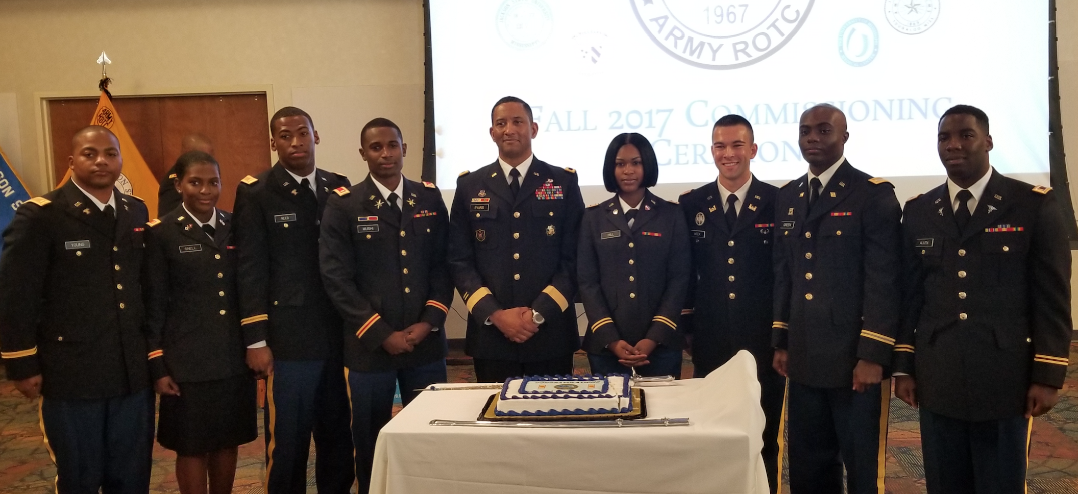 Major Gen. Jason T. Evans, center, was the keynote speaker for the commissioning and bar ceremony. He joins the newly his new fellow officers.