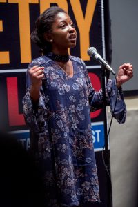 Mills gave an emotional citation of the literary work, "I Go Back to May 1937" by Sharon Olds. (Photo by Charles A. Smith/JSU)