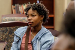 Senior Myesha Stovall listens attentively as Dr. Robert Luckett, director of the Margaret Walker Center, talks about Walker and her writing. (Photo by Charles A. Smith/JSU)