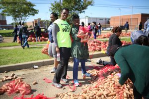 JSU staffers get in on the action through their volunteer efforts. (Photo by Charles A. Smith/JSU)
