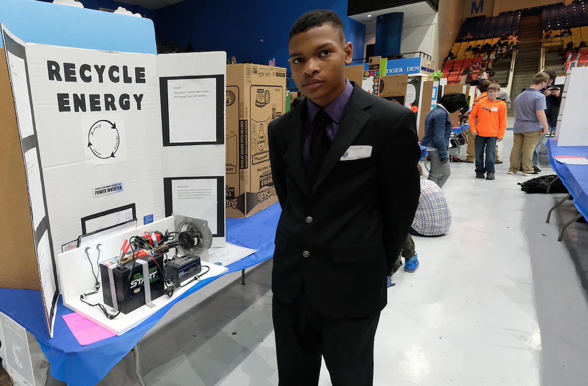 A student-competitor proves that a power inverter can recycle energy from a 12-volt battery. (Photo by Charles A. Smith/JSU)