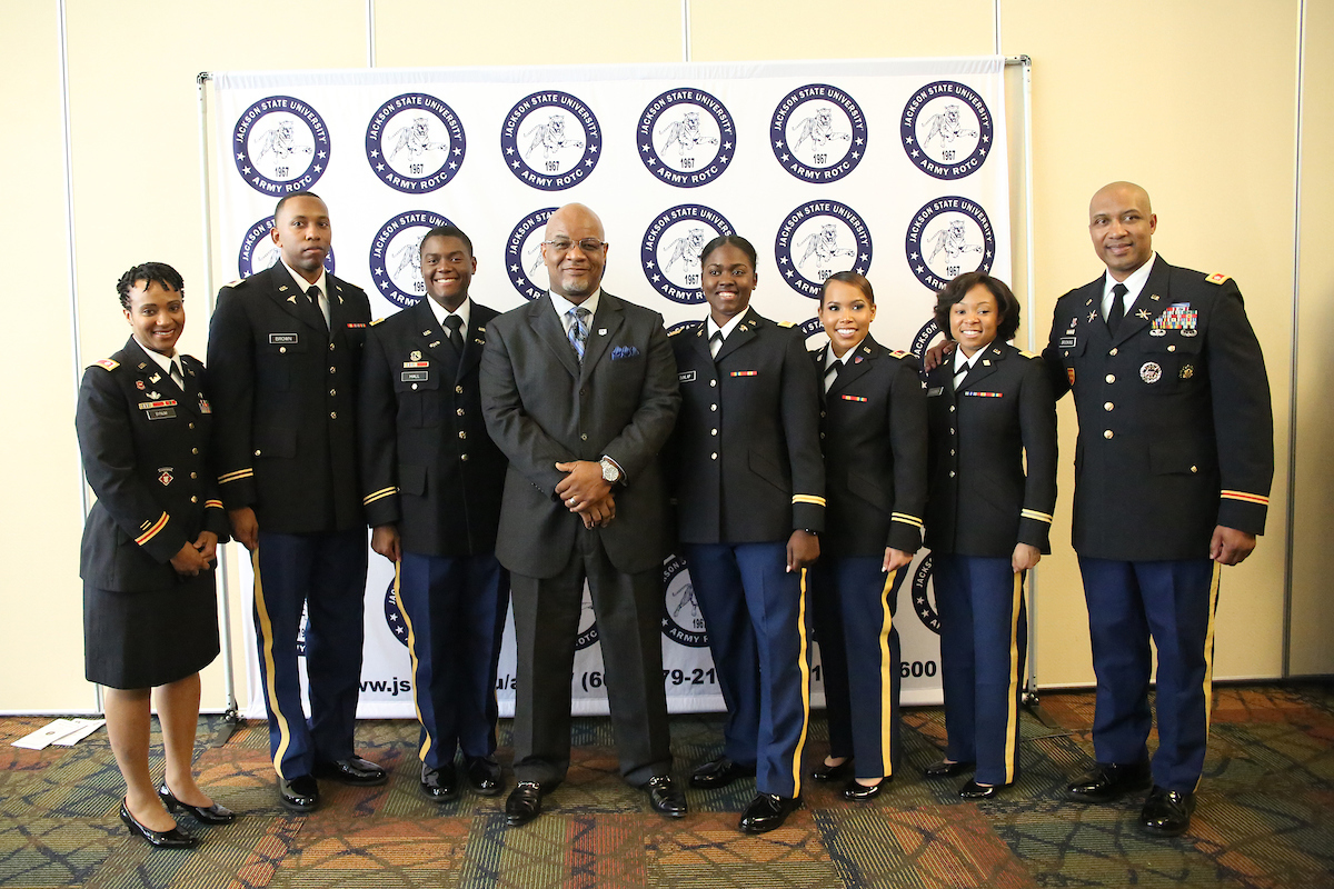 JSU President William B. Bynum Jr. and Lt. Col. Dexter Brookins congratulate five new second lieutenants and an alum earning the rank of lieutenant colonel during a commissioning ceremony. The honorees are Lt. Col. Natalie Bynum, left, and 2nd Lieutenants Gabriel E. Brown, Louis J. Hall, Ebony C. Dunlap, Andrea N. Thomas and Rolundra O. Rhodes. (Photo by Aron Smith/JSU)