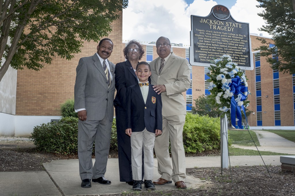 Several people attended the 48th anniversary of the deadly tragedy at JSU that occurred May 15, 1970. Standing in front of Alexander Hall, which was struck by gunfire, are survivors Lee Bernard, left, Eddie Jean Carr and James “Lap” Baker. They’re accompanied by Aeneas Bridges, who is learning about JSU’s past so he can be part of its future.