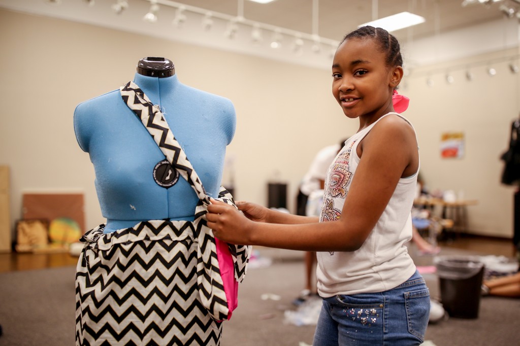 Destiny Jackson, a rising sixty grader, shows off the purse and skirt that she crafted while participating in the JSU sewing summer camp. The 11-year-old hopes to be a fashion designer crafting garments for women and young girls. (Photo by Charles A. Smith/JSU)