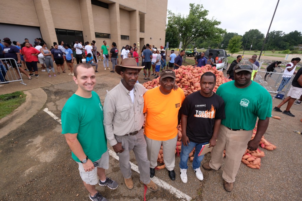 The team responsible for providing and transporting the produce gathers in solidarity. (Photo by Charles A. Smith/JSU)