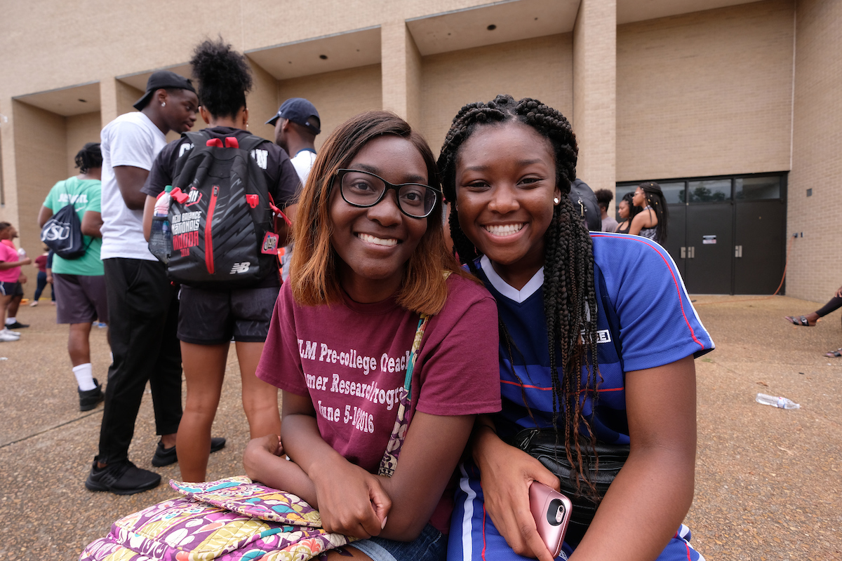 For two freshmen computer science majors, Crop Drop was a special day to remember. Catavia Allen of Lake Providence, Louisiana, left, said, “It was fun helping out the community and giving food to people.” Her friend Atayliya Irving of Dallas said, “It was amazing to see how everyone came out and to see how teamwork really makes the dreamwork.” (Photo by Charles A. Smith/JSU)