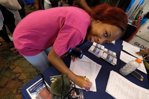 A freshman signs up for more information about JSU’s services during the Campus Resource Fair. (Photo by Charles A. Smith/JSU)