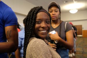 A new student embraces JSU as her home for the next few years as she mills around the Student Center gathering more information about departments and other units on campus. (Photo by Charles A. Smith/JSU)