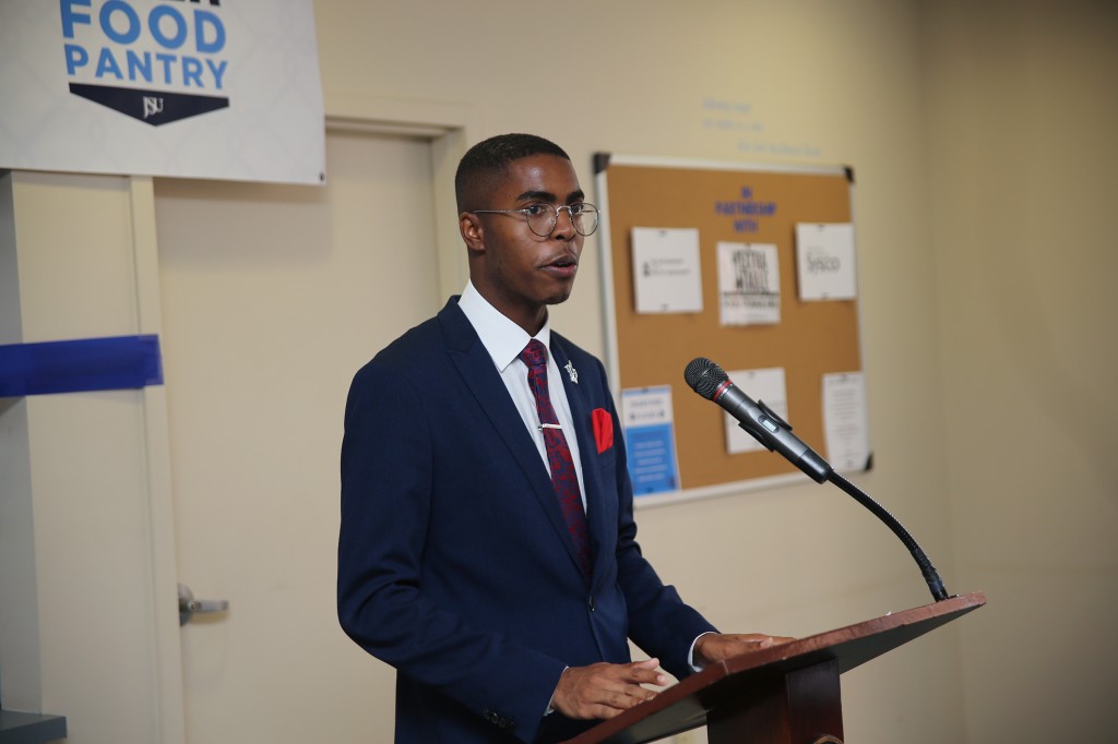 Khaylan Foy, the university's Mr. Senior (2018-2019) introduces Dr. William B. Bynum Jr., to share remarks with the audience at the ribbon-cutting for the Tiger Food Pantry. (Aron Smith/University Communications)