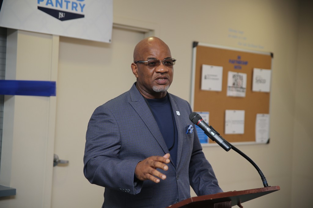 JSU President Dr. William B. Bynum, Jr., expresses his admiration for his wife, Deborah Bynum, during the ribbon-cutting ceremony for her food pantry initiative. (Aron Smith/University Communications)