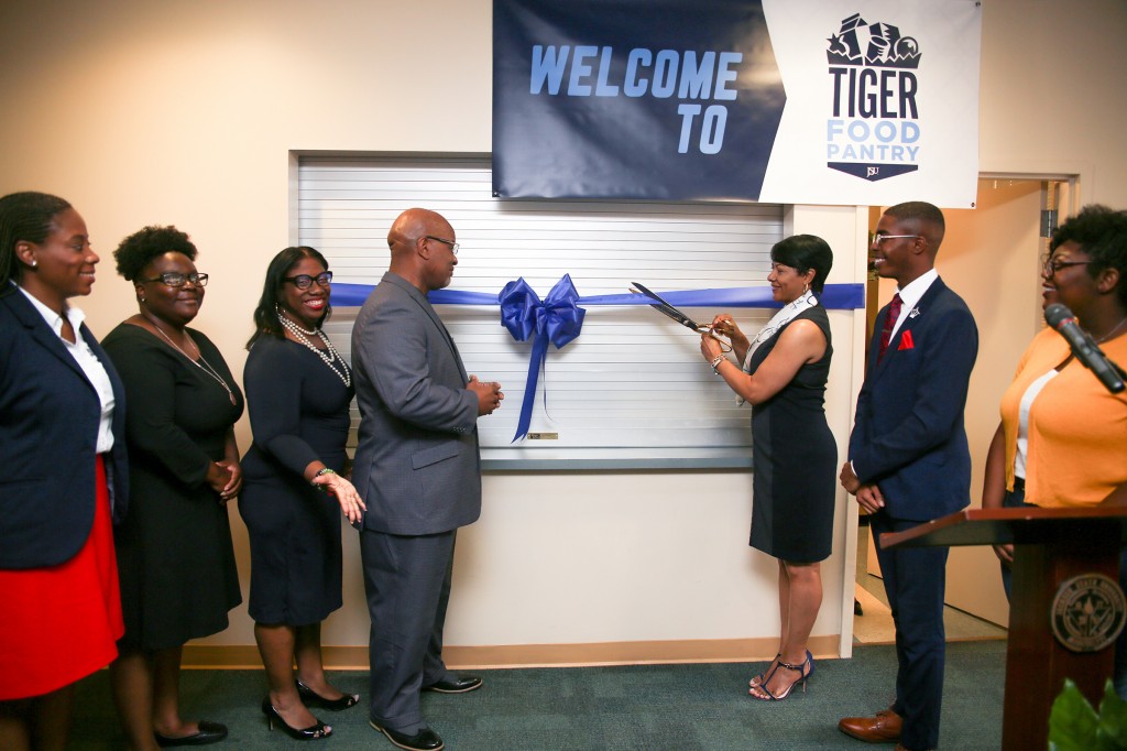 Deborah Bynum, first lady of JSU, prepares to cut the ribbon on the Tiger Food Pantry while surrounded by campus partners who aided in the initiative. (Photo by Aron Smith/University Communications)