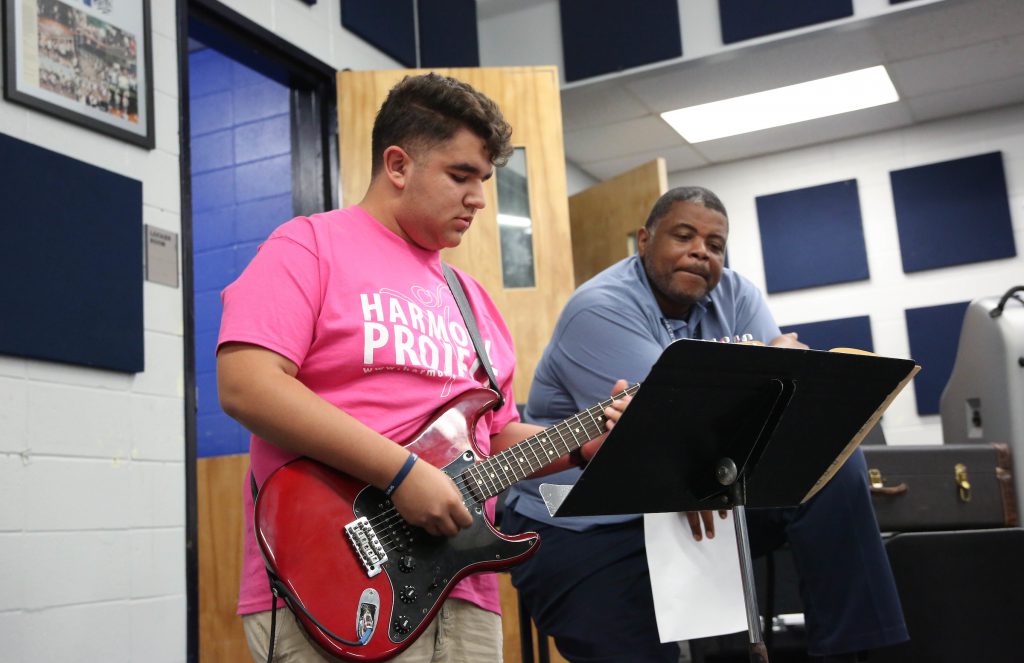 Established nearly 17 years ago in Los Angeles County, the Harmony Project is a nonprofit that provides free musical instruments and lessons to children from low-socioeconomic backgrounds. Every student also plays in an ensemble or orchestra. One L.A. student receives guidance from a JSU instructor during the group's three-day visit to the campus. (Photo by Kentrice S. Rush/JSU University Communications)