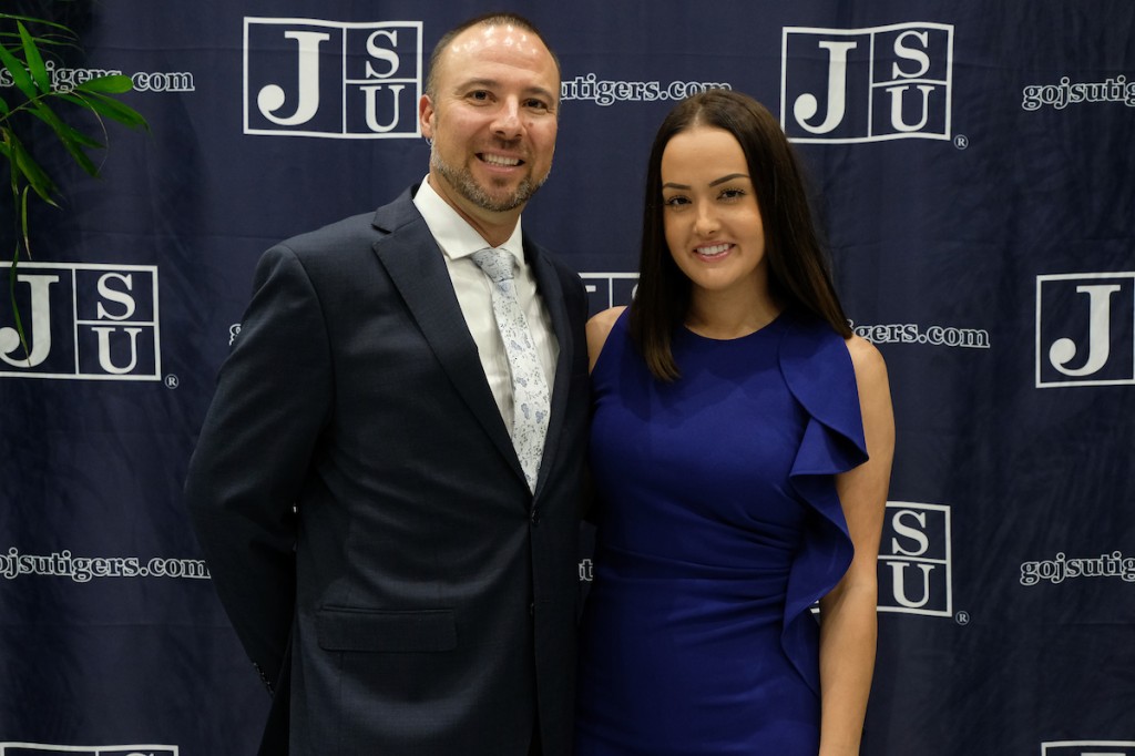 Newly inducted Hall of Famer A.J. Montecinos, with friend Brittany Graul, celebrates his honor. (Photo by Charles A. Smith)
