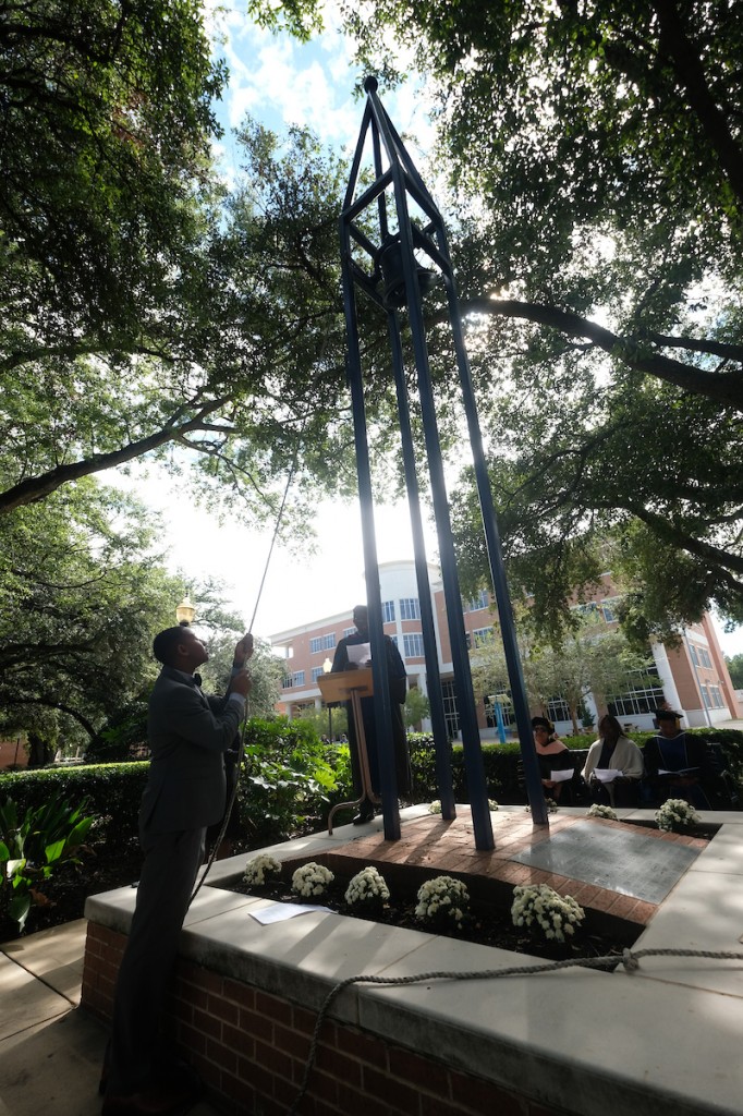 Dr. Hilliard Lackey and Michael Ware, a senior sociology major and president of the Campus Activities Board, assist with ringing the Centennial Bell in front of Ayer Hall on Founders’ Day. (Photo by Charles A. Smith/JSU)