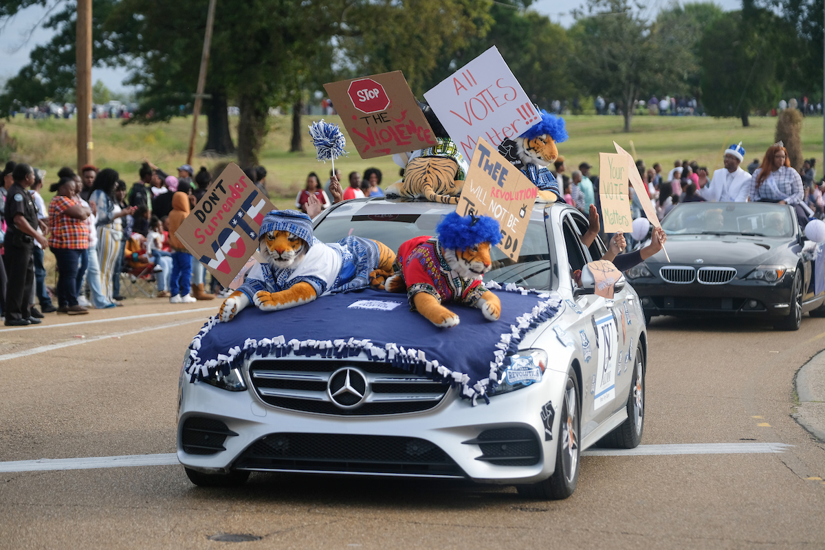 Participants promote voting as November elections approach. (Photo by Charles A. Smith)