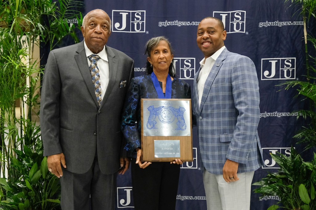 Division of Athletics supporter Nora Jean Oatis played a significant role in the history of the J-Settes, cheerleaders and tumblers. She's congratulated by Dr. Walter Reed, left, and Ashley Robinson, JSU's vice president and Athletic Director. (Photo by Charles A. Smith)