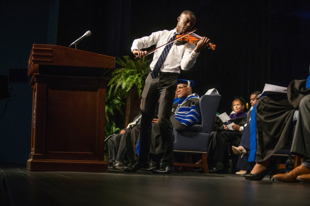 Violinist John Uzodinma gave a moving tribute to Dr. William B. Bynum Jr. that brought the audience to their feet during the investiture service that was filled with music and testimonies. (Photo by Charles A. Smith/JSU)