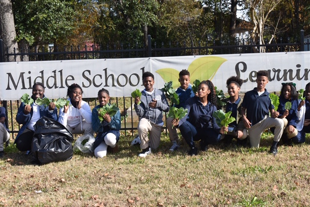 After caring for the garden for several months, student show the results of their harvest. A Blackburn science instructor also said the project helped improve grades and attitudes.