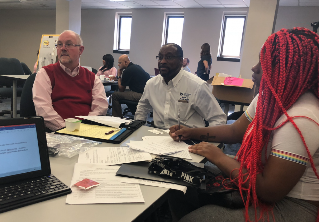 Dr. John R. Mader, center, talks about research support from the Hispanic Association of Colleges and Universities. He’s part of the collaboration that includes Barley, left, and Poole. (Photo by L.A. Warren/JSU)