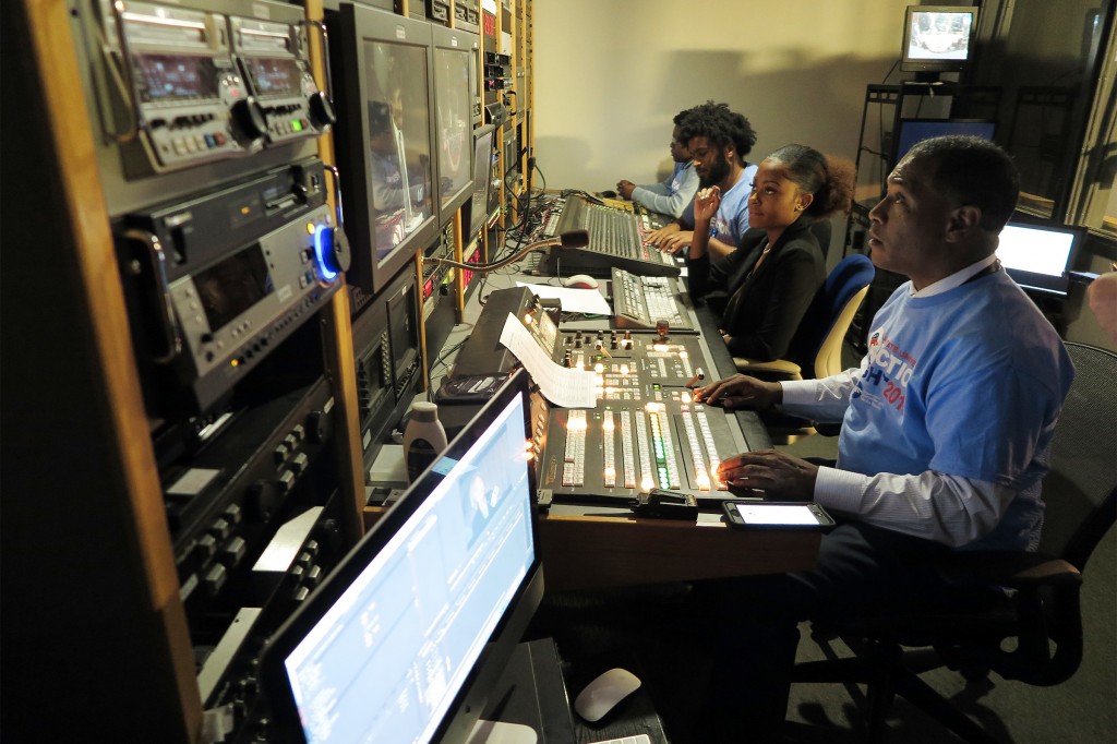 Behind the scenes in the control room, students helped to type scripts for the monitors and update guest information and notify panelists of upcoming commercial breaks. (Photo by Rachel James-Terry/JSU)